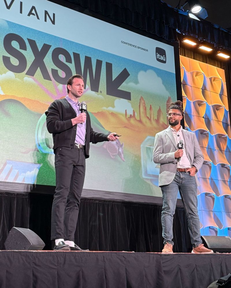 John Scott presenting on stage at SXSW 2025